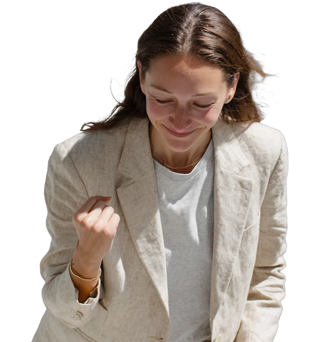 A person looking down at their work, the system running behind them