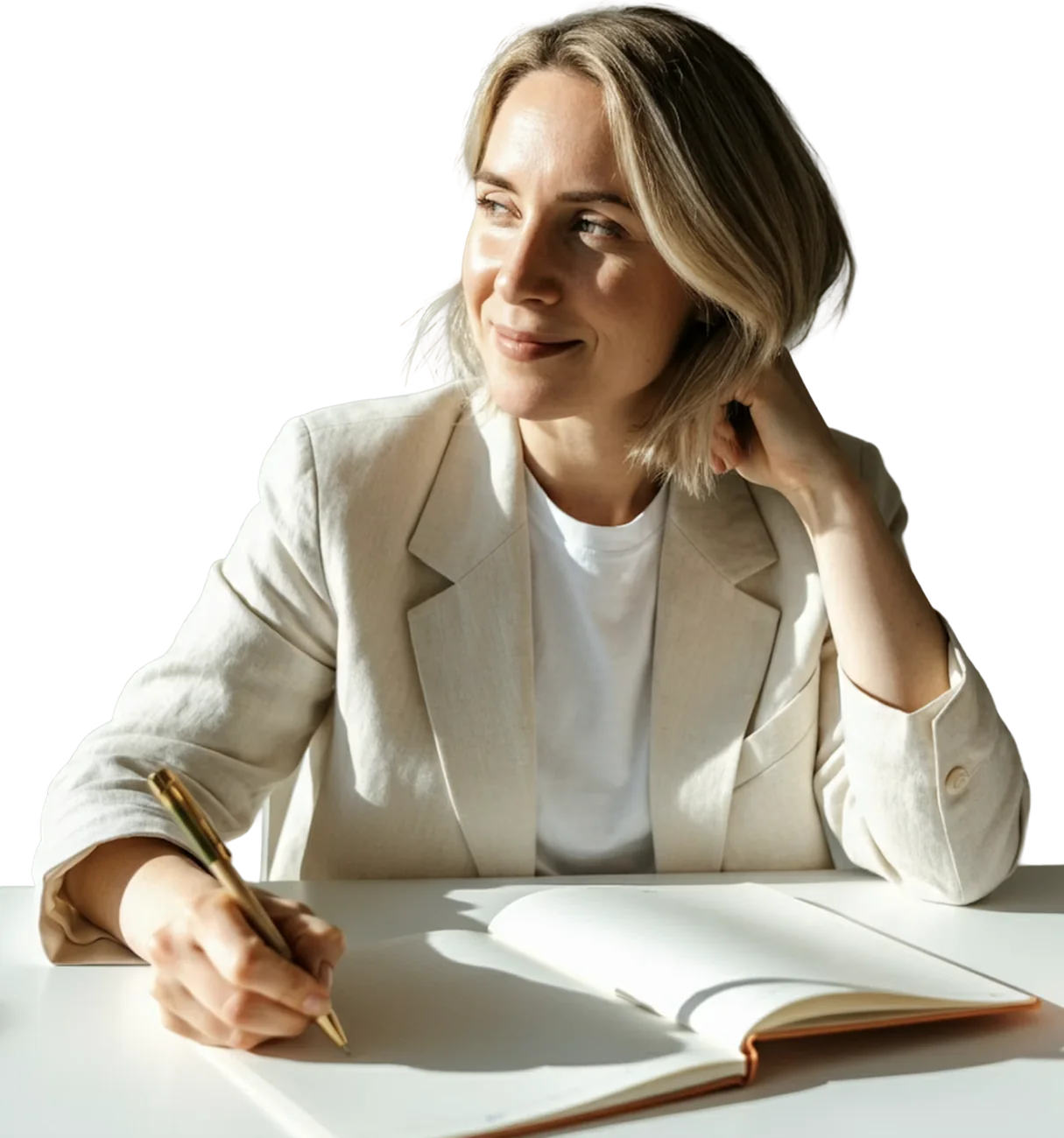 A person at a desk, writing, while the system works behind her